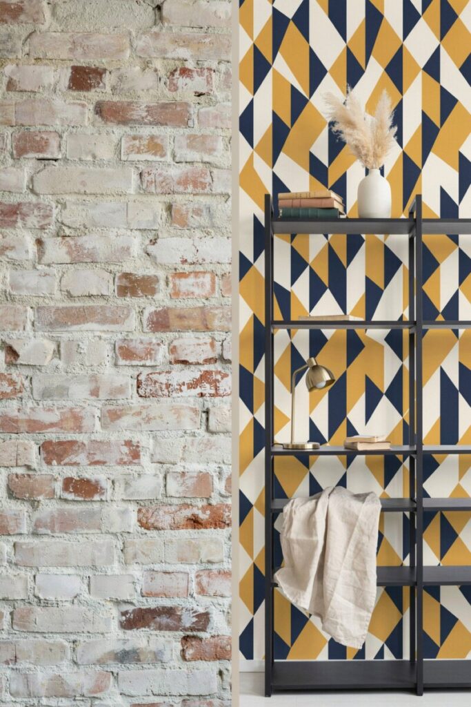 Limewash paint treatment on exposed brick and renter-friendly peel-and-stick wallpaper inside a metal bookshelf