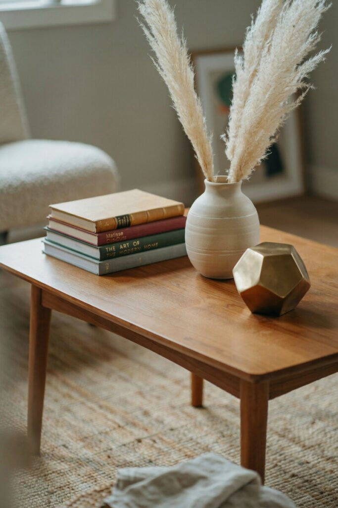 Modern boho decor vignette showing a vintage and modern mix on a mid-century coffee table.